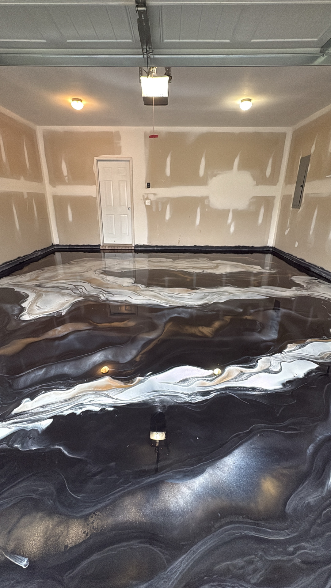Garage with black and silver metallic epoxy floor