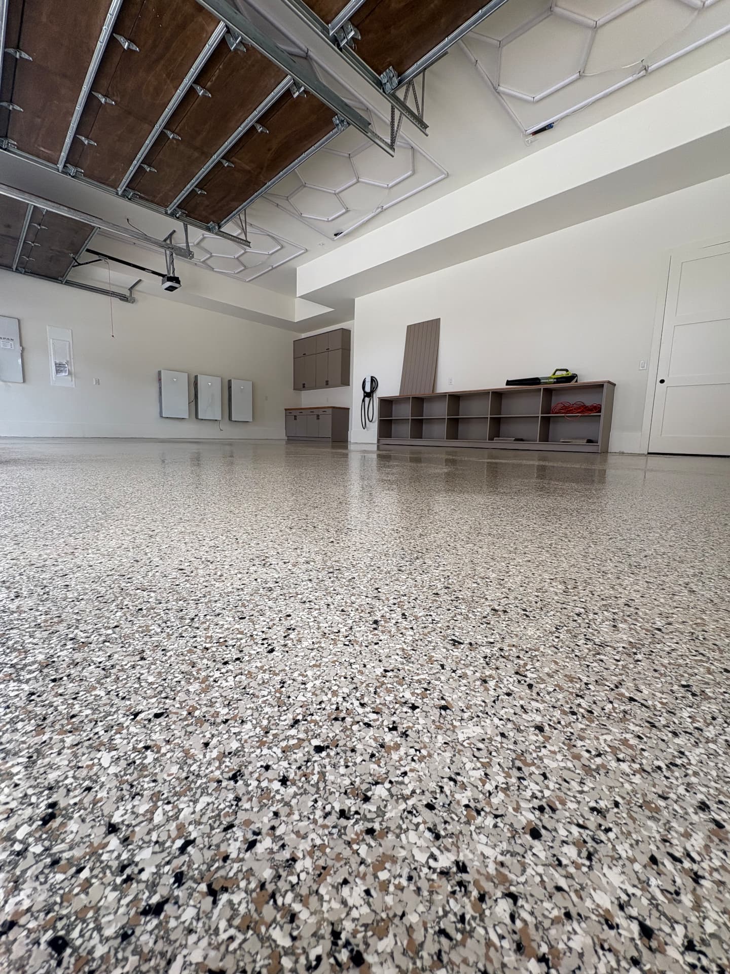 Flake epoxy garage floor in a service bay
